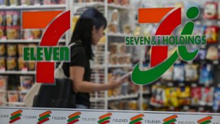 A customer is seen inside a 7-Eleven convenience store along a street in central Tokyo on September 9, 2024.  