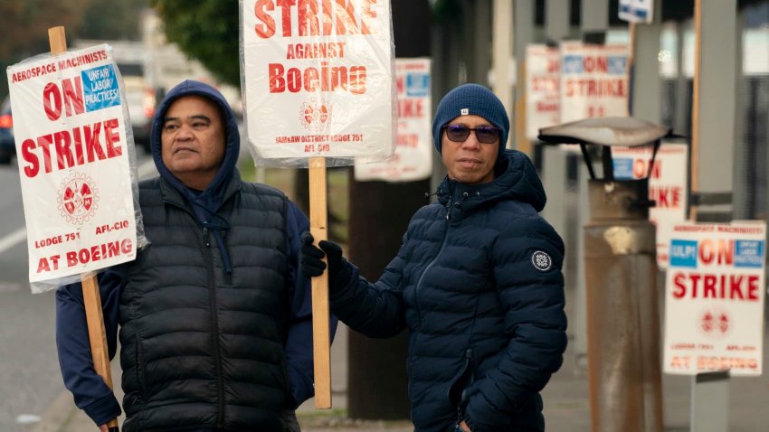 Boeing workers gather on a picket line near the entrance to a Boeing facility during an ongoing strike on October 24, 2024 in Seattle, Washington. 