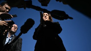 Vice President and Democratic presidential nominee Kamala Harris talks to reporters before boarding Air Force Two at Joint Base Andrews in Maryland on October 30, 2024. 