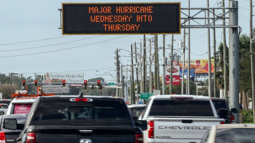 Highway signage announces the impending arrival of Hurricane Milton and the evacuations zones on Tuesday, Oct. 8, 2024, in Port Richey, Fla. (AP Photo/Mike Carlson)