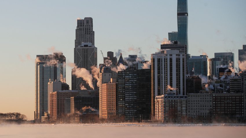 Steam rises from the city buildings and Lake Michigan during sunrise in Chicago, Illinois, on February 7, 2021. – According to the National Weather Service, dangerous wind chills can bring temperatures to up to 25 degrees Fahrenheit below zero in the Chicago area on Sunday. (Photo by KAMIL KRZACZYNSKI / AFP) (Photo by KAMIL KRZACZYNSKI/AFP via Getty Images)