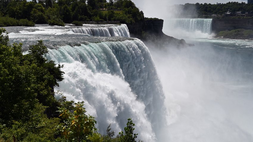 TOPSHOT – A general view shows water flowing over Niagara Falls in Niagara Falls, New York, on August 13, 2022.