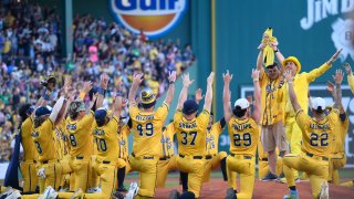 BOSTON, MASSACHUSETTS – JUNE 08: Members of the Savannah Bananas participate in a pre-game ceremony before a game against the Party Animals at Fenway Park on June 08, 2024 in Boston, Massachusetts. (Photo by Jaiden Tripi/Getty Images)