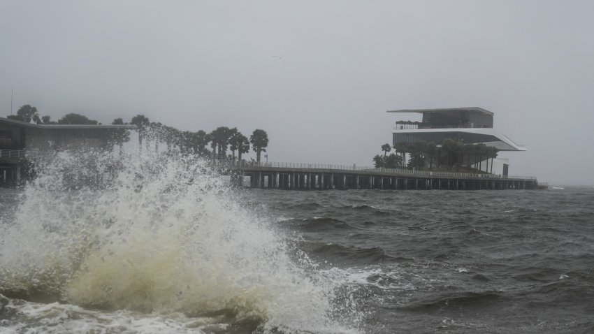 Waves crash along St. Pete Pier in St. Petersburg as Hurricane Milton is expected to make landfall tonight on October 9, 2024 in Florida. Milton regained power on October 8 to become a Category 5 storm with maximum sustained winds of 165 mph (270 kph) as it barrels towards the west-central coast of Florida and is forecast to make landfall late October 9, according to the National Hurricane Center. (Photo by Bryan R. SMITH / AFP) (Photo by BRYAN R. SMITH/AFP via Getty Images)