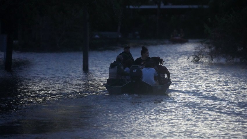 Residents are rescued from an apartment complex in Clearwater that was flooded from and overflowing creek due to Hurricane Milton on October 10, 2024 in Florida.