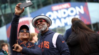 LONDON, ENGLAND – OCTOBER 13: Fans of Chicago Bears pose for a selfie, outside the stadium prior to the NFL match between Jacksonville Jaguars and Chicago Bears at Tottenham Hotspur Stadium on October 13, 2024 in London, England. (Photo by Richard Heathcote/Getty Images)