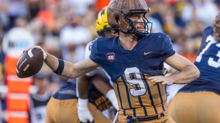 CHAMPAIGN, ILLINOIS – OCTOBER 19: Luke Altmyer #9 of the Illinois Fighting Illini drops back to throw the ball during the second half against the Michigan Wolverines at Memorial Stadium on October 19, 2024 in Champaign, Illinois.  (Photo by Michael Hickey/Getty Images)