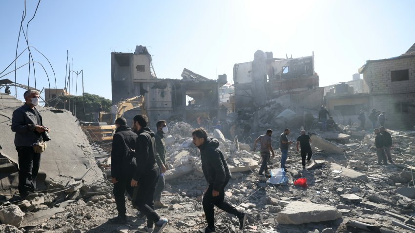 People inspect the debris a day after an Israeli airstrike in Beirut’s southern suburb of Jnah on October 22, 2024, amid the ongoing war between Israel and Hezbollah.