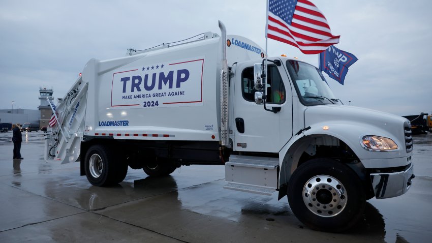 GREEN BAY, WISCONSIN – OCTOBER 30: A garbage truck is is decked out with campaign signs and flags for Republican presidential nominee, former President Donald Trump on the tarmac at Green Bay Austin Straubel International Airport on October 30, 2024 in Green Bay, Wisconsin. With less than a week until Election Day, Trump continues to campaign in the battleground swing states.  (Photo by Chip Somodevilla/Getty Images)