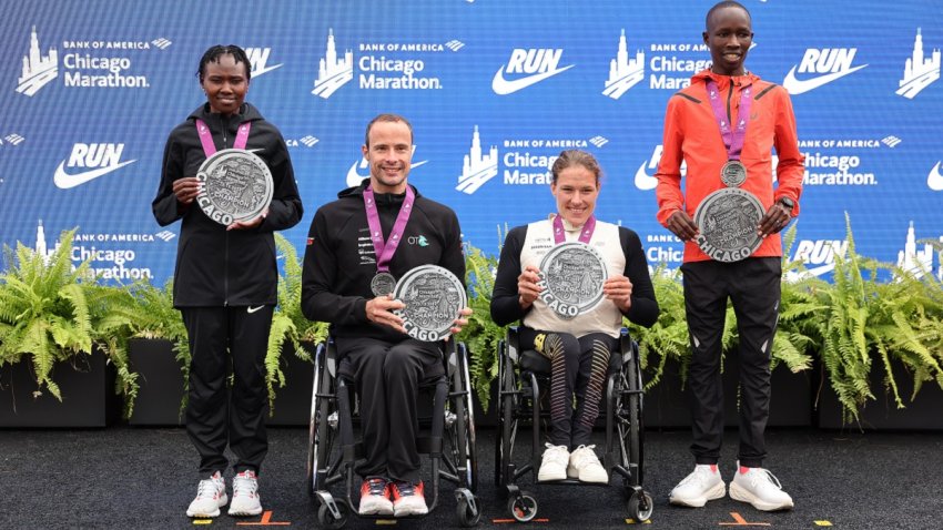 CHICAGO, ILLINOIS – OCTOBER 13: (L-R) Ruth Chepngetich of Kenya, Marcel Hug of Switzerland, Catherine Debrunner of Switzerland and John Korir of Kenya pose for a photo after winning the 2024 Chicago Marathon at Grant Park on October 13, 2024 in Chicago, Illinois. (Photo by Michael Reaves/Getty Images)