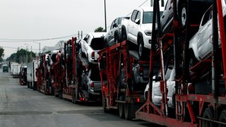 A carrier trailer transports Toyota cars for delivery while queuing at the border customs control to cross into the U.S., at the Otay border crossing in Tijuana, Mexico May 31, 2019.