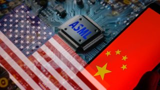 An ASML icon is being displayed on a circuit board, alongside the flags of the USA and China, in this photo illustration taken in Brussels, Belgium, on January 4, 2024.