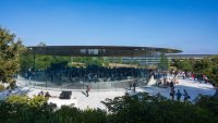 Peopl walk outside Steve Jobs Theater at the Apple Park campus before Apple’s “It’s Glowtime” event in Cupertino, California, on Sept. 9, 2024.