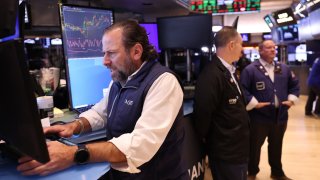 Traders work on the floor of the New York Stock Exchange during the morning trading on November 07, 2024 in New York City. 