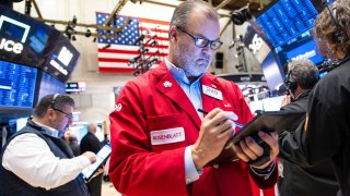 Traders work on the New York Stock Exchange floor on November 12, 2024 in New York City.