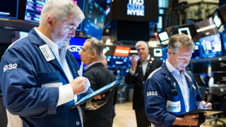 Traders work on the New York Stock Exchange floor on November 12, 2024 in New York City.