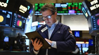 Traders work on the floor of the New York Stock Exchange at the opening bell on November 13, 2024, in New York City. 