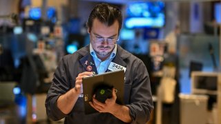 Traders work on the floor of the New York Stock Exchange at the opening bell on November 13, 2024, in New York City. 