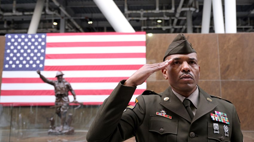 Sgt. 1st Class Keith Greenwood salutes during a Veterans Day event at Soldier Field on Nov. 11, 2022, in Chicago. Veterans Affairs plans to slash reimbursements for the ambulances that transport veterans to medical facilities. (Michael Blackshire/Chicago Tribune/Tribune News Service via Getty Images)