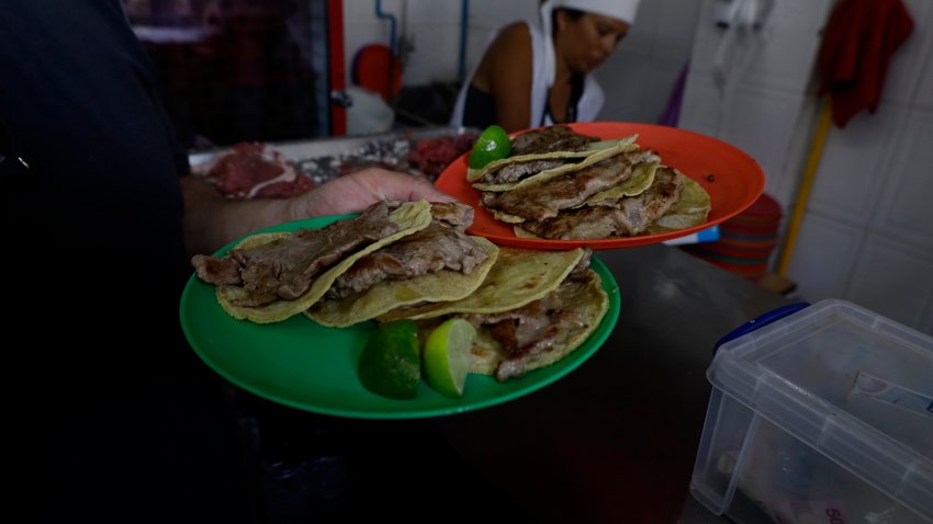 Diners at Taqueria El Califa de Leon in Mexico City are holding plates with roast beef tacos for consumption.
In recent days, the Michelin Guide, which is the most important and famous restaurant and hotel guide in the world, is awarding a star to this establishment because it is considering that they are offering ''very good cuisine in its category'' of neighborhood or street cuisine. (Photo by Gerardo Vieyra/NurPhoto via Getty Images)