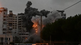 A fireball erupts at the site of an Israeli airstrike Monday in Tayouneh in Beirut's southern suburbs.