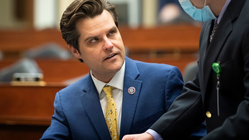 Rep. Matt Gaetz, R-Fla., talks with a staffer before the start of a House Armed Services Committee hearing in Washington, May 12, 2021.