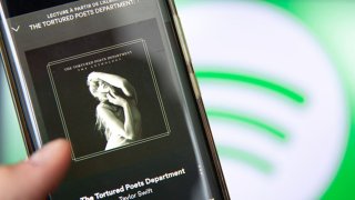 This photograph taken in Paris on April 19, 2024, shows a smatphone displaying the US singer-songwriter Taylor Swift’s new album “The Tortured Poets Department” on Spotify. Queen of pop Taylor Swift released her highly anticipated record “The Tortured Poets Department” on April 19, 2024  — the 11th studio album from the megastar who is already having a blockbuster year. 