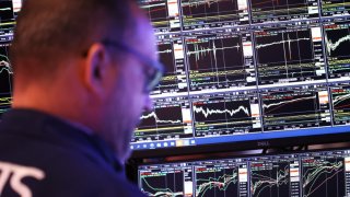 Traders work on the floor of the New York Stock Exchange during the morning trading on Nov. 7, 2024.