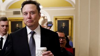 Elon Musk walks on Capitol Hill on the day of a meeting with Senate Republican Leader-elect John Thune (R-SD), in Washington, U.S. December 5, 2024. 