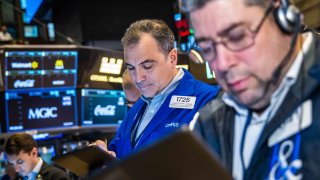 Traders work at the New York Stock Exchange on Dec. 17, 2024.