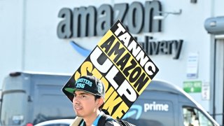 Amazon workers walk the picket line outside an Amazon facility in the City of Industry, California on December 19, 2024.