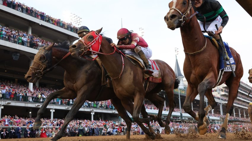 Mystik Dan #3, ridden by jockey Brian J. Hernandez Jr. (R), crosses the finish line ahead of Sierra Leone #2, ridden by jockey Tyler Gaffalione and Forever Young, ridden by jockey Ryusei Sakai to win the 150th running of the Kentucky Derby at Churchill Downs on May 04, 2024 in Louisville, Kentucky. 