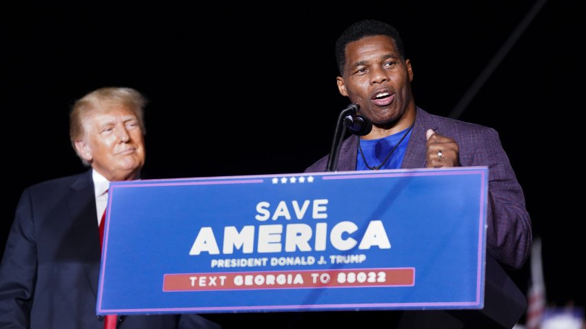 PERRY, GA - SEPTEMBER 25: Republican Senate candidate Herschel Walker, right, speaks at a rally with former President Donald Trump on September 25, 2021 in Perry, Georgia.