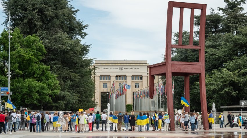 Protesters are seen demonstrating in front of the UN headquarter