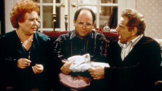 Pictured: (L-R) Jerry Stiller as Frank Costanza, Jason Alexander as George Costanza, Estelle Harris as Estelle Costanza on the set of "Seinfeld."