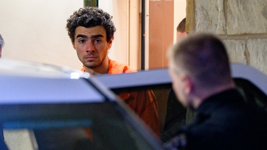 HOLLIDAYSBURG, PENNSYLVANIA – DECEMBER 10: Suspected shooter Luigi Mangione is led from the Blair County Courthouse after an extradition hearing December 10, 2024 in Hollidaysburg, Pennsylvania. Mangione has been arraigned on weapons and false identification charges related to the fatal shooting of United Healthcare CEO Brian Thompson in New York City. Mangione is incarcerated in the State Correctional Institution in Huntingdon, Pennsylvania awaiting extradition to New York.