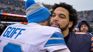 CHICAGO, ILLINOIS – DECEMBER 22: Caleb Williams #18 of the Chicago Bears and Jared Goff #16 of the Detroit Lions embrace following the game at Soldier Field on December 22, 2024 in Chicago, Illinois. (Photo by Quinn Harris/Getty Images)