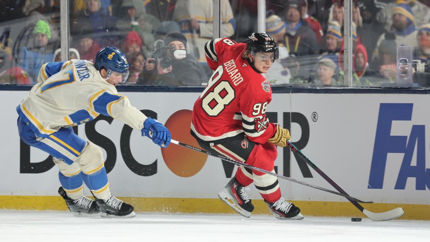 CHICAGO, ILLINOIS – DECEMBER 31: Connor Bedard #98 of the Chicago Blackhawks skates against Cam Fowler #17 of the St. Louis Blues during the third period in the 2024 NHL Winter Classic at Wrigley Field on December 31, 2024 in Chicago, Illinois. (Photo by Michael Reaves/Getty Images)