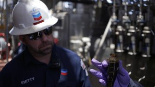 Offshore workers examine hydrocarbon samples aboard the Chevron Corp. Jack/St. Malo deepwater oil platform in the Gulf of Mexico off the coast of Louisiana, U.S., on Friday, May 18, 2018.