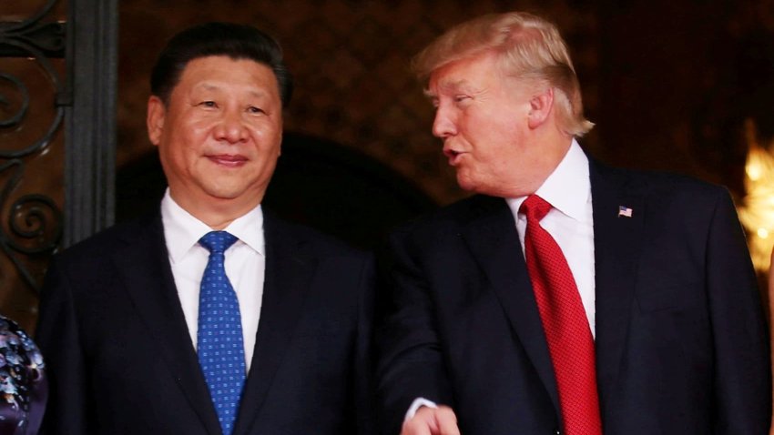 President Donald Trump talks with Chinese President Xi Jinping as Xi arrives for dinner at the start of their summit at Trump’s Mar-a-Lago estate in West Palm Beach, Florida, U.S. April 6, 2017.