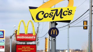 A sign hangs outside of a CosMc’s restaurant, a concept recently launched by McDonald’s, in Bolingbrook, Illinois, on Dec. 11, 2023.