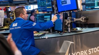 Traders work on the floor of the New York Stock Exchange (NYSE) on the first day of trading of the new year on January 02, 2025 in New York City. 