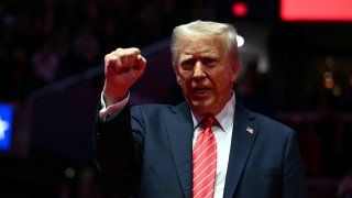 President-elect Donald Trump reacts during a MAGA victory rally at Capital One Arena in Washington, DC, on January 19, 2025, one day ahead of his inauguration ceremony.