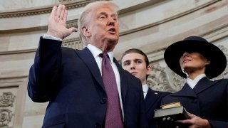 Donald Trump is sworn in as the 47th President of the United States by Chief Justice John Roberts as Melania Trump holds the Bible during the 60th Presidential Inauguration in the Rotunda of the U.S. Capitol in Washington, U.S., Jan. 20, 2025.
