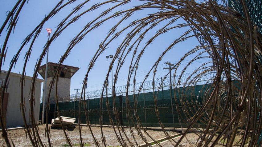 In this April 17, 2019, photo, reviewed by U.S. military officials, the control tower is seen through the razor wire inside the Camp VI detention facility in Guantanamo Bay Naval Base, Cuba.