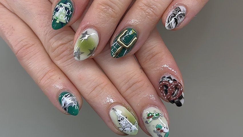 Fingernails made up with Philadelphia Eagles imagery.
