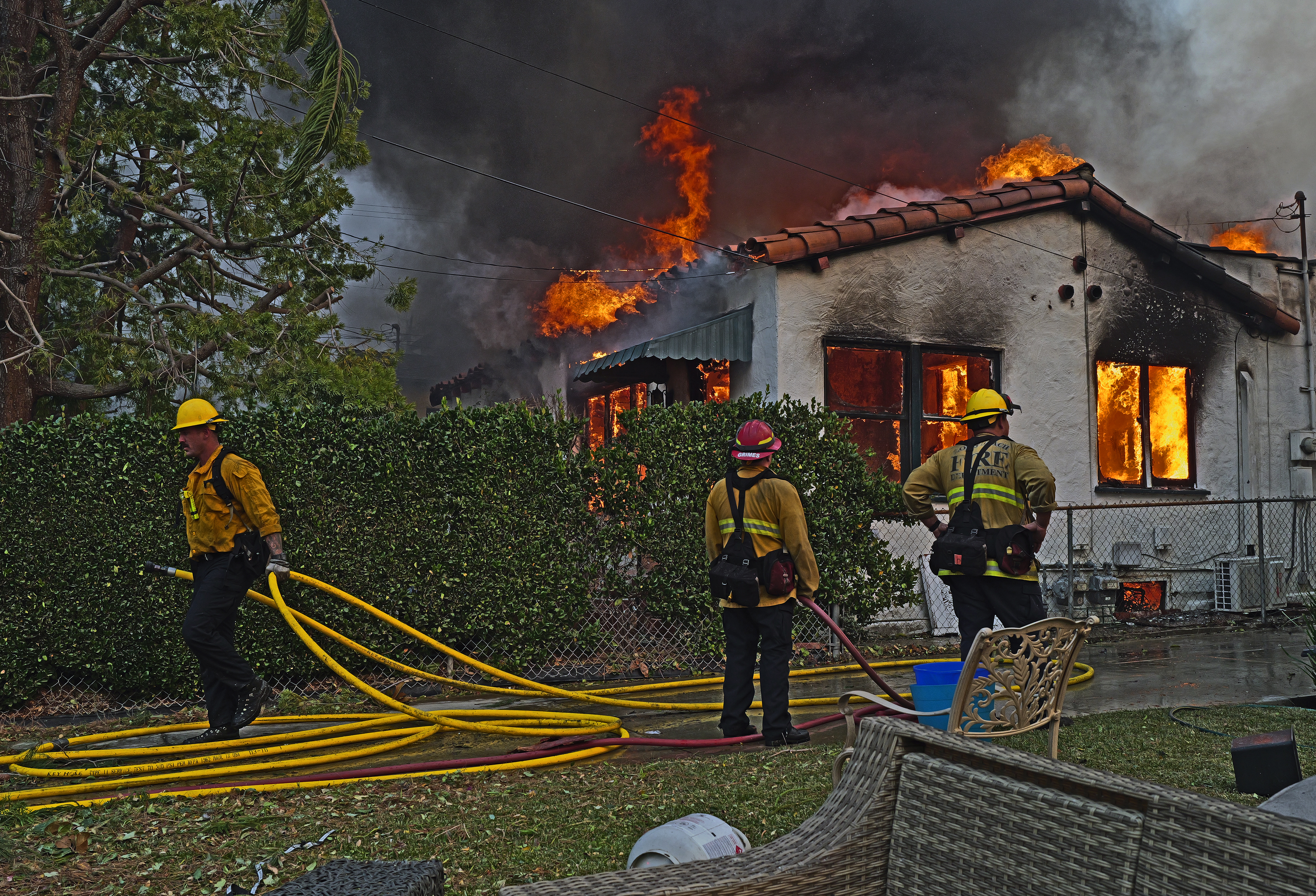 PASADENA, CALIFORNIA – January 08: A house is on fire from the Eaton Fire in the Altadena neighborhood on January 08, 2025 in PASADENA, CALIFORNIA.