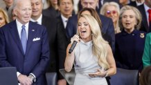 Country singer Carrie Underwood (C) performs 'America the Beautiful' as former US President Joe Biden (L) looks on during US President Donald Trump's inauguration ceremony in the rotunda of the United States Capitol in Washington, DC, on January 20, 2025. (Photo by SHAWN THEW / POOL / AFP) (Photo by SHAWN THEW/POOL/AFP via Getty Images)