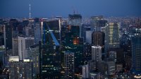 Commercial and residential buildings at dusk in the Minato district of Tokyo, Japan.