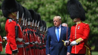 U.S. President Donald Trump inspected an honour guard during a welcome ceremony at Buckingham Palace in central London on June 3, 2019, on the first day of their three-day State Visit to the U.K.